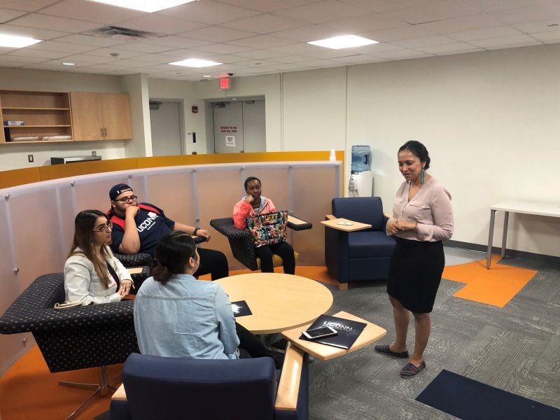 Professor Rupal Parekh with students in student lounge