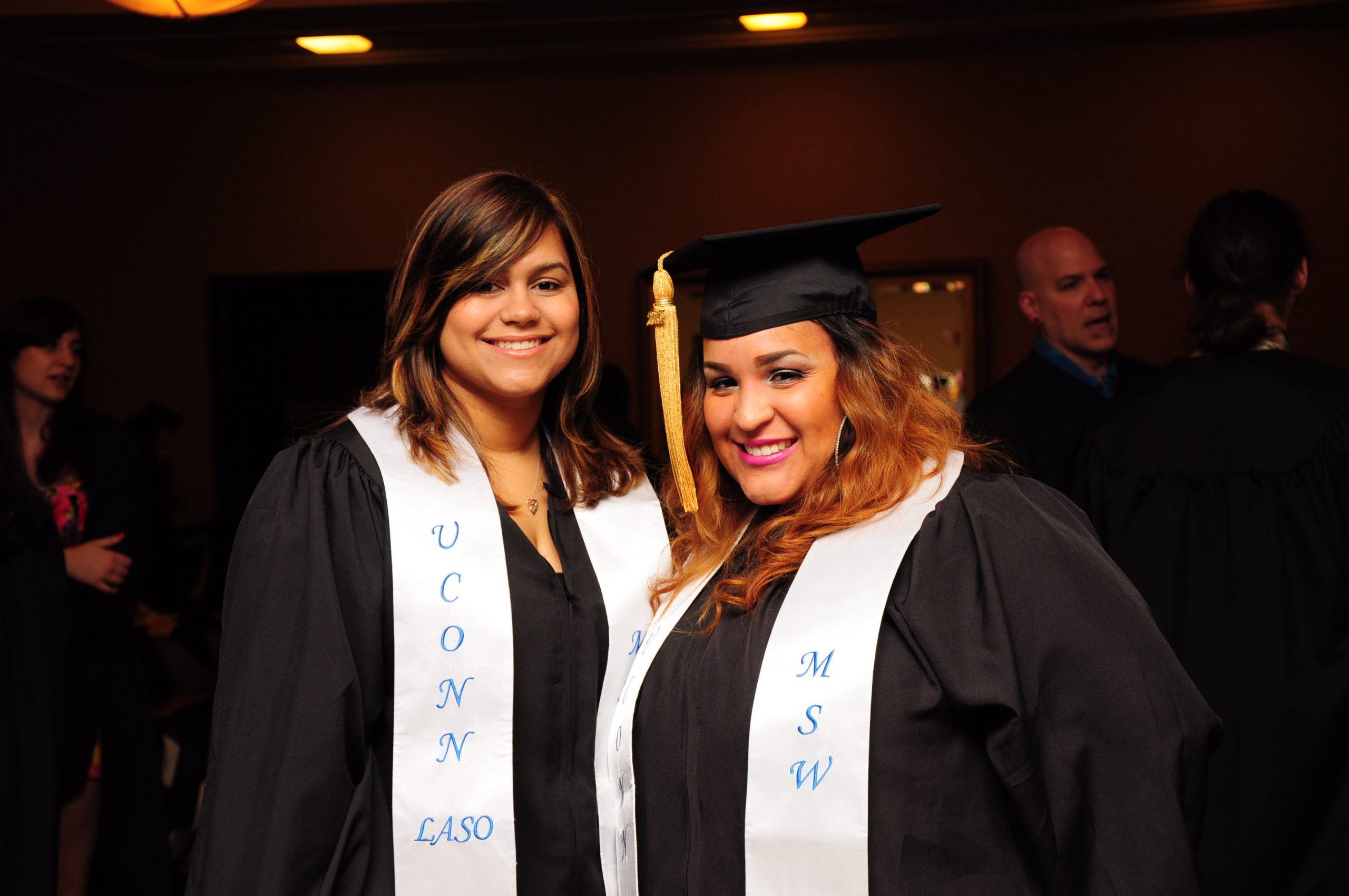 Two Latina student graduates