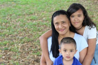 Hispanic mother with two children.