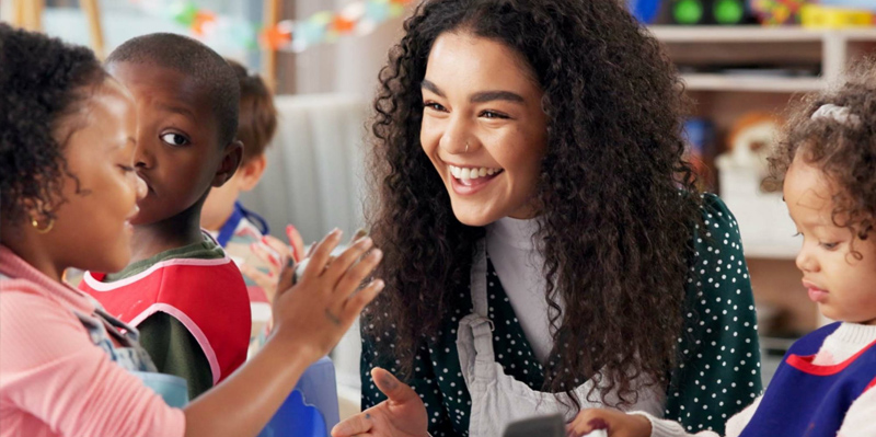 student walking across the front of the school of social work building
